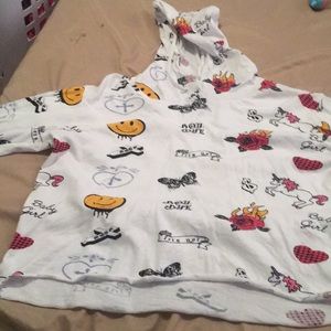 A white crop top with a horror long sleeve